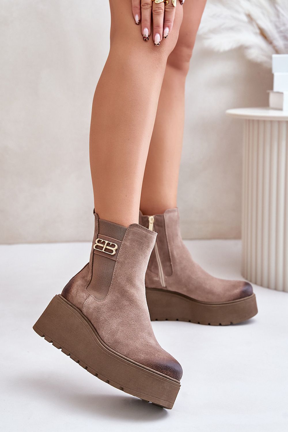Varelyn suede platform boots with side zipper and decorative detail, featuring a thick heel for height and felt-insulated warmth.