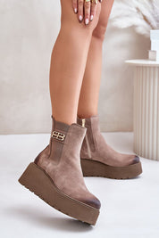Varelyn suede platform boots with side zipper and decorative detail, featuring a thick heel for height and felt-insulated warmth.