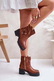 Model wearing brown leather platform heel boots with side zipper