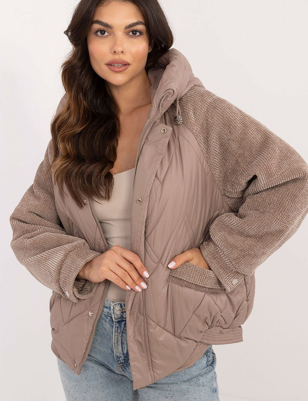 Velmora Quilted Hooded Jacket with corduroy sleeves, worn by model. Perfect for cool autumn and winter days, blending style and comfort.