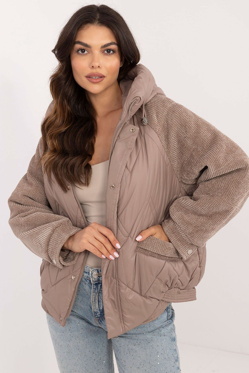 Velmora Quilted Hooded Jacket with corduroy sleeves, worn by model. Perfect for cool autumn and winter days, blending style and comfort.