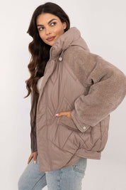 Velmora Quilted Hooded Jacket with corduroy sleeves, featuring a smooth quilted body and hood, styled for autumn and winter wear.