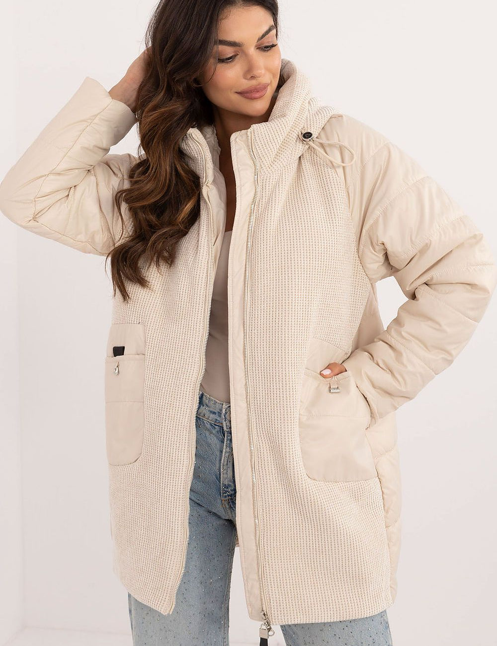 Woman wearing Cordivelle Quilted Hooded Jacket with corduroy front and quilted sections, perfect for autumn and winter.