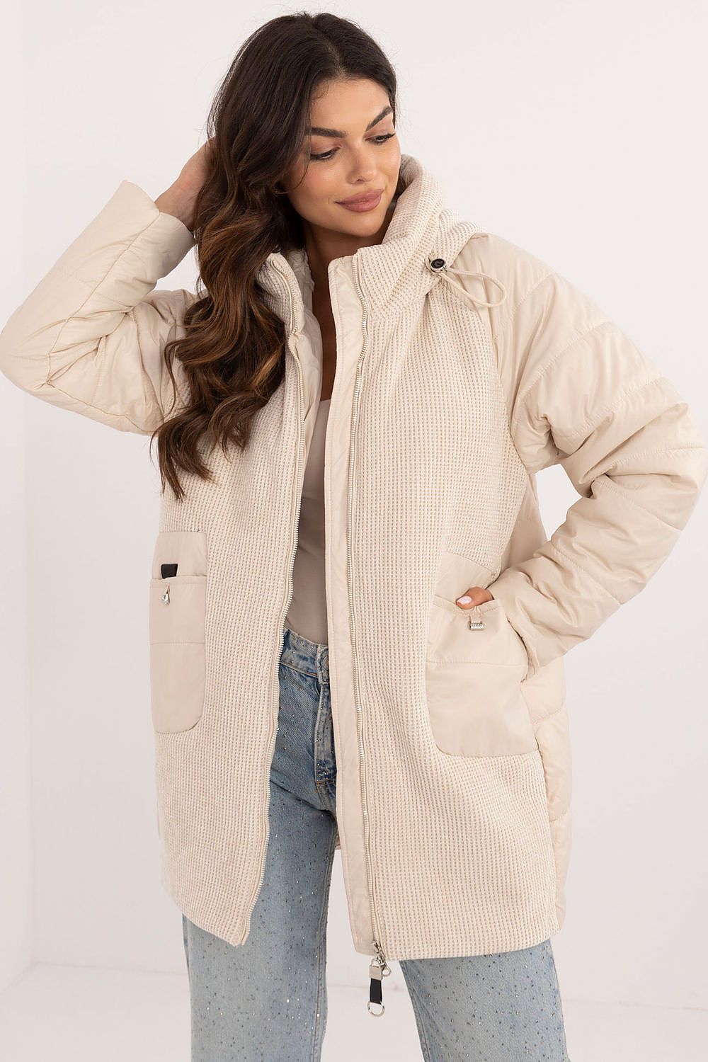 Woman wearing Cordivelle Quilted Hooded Jacket with corduroy front and quilted sections, perfect for autumn and winter.