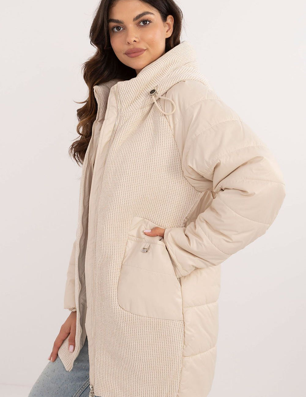Woman wearing Cordivelle Quilted Hooded Jacket with corduroy front panel, quilted sections, and zip closure for warmth and style.