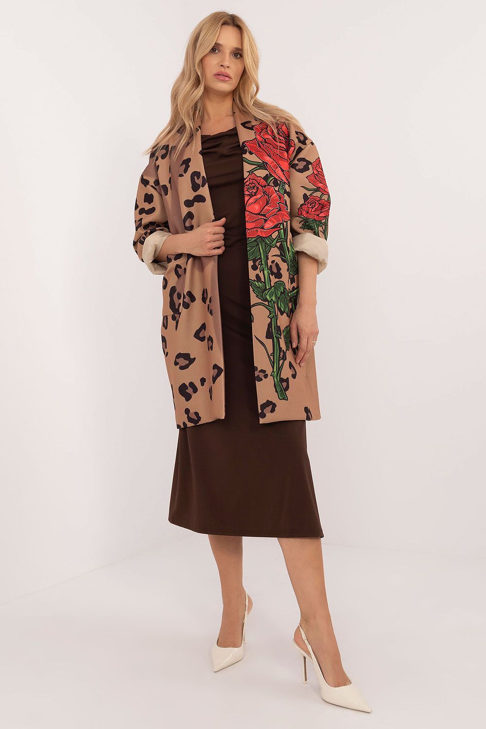 Woman wearing Florénne Rhinestone Rose Coat, showcasing a brown dress beneath, open-front design with rose print and rhinestone accents