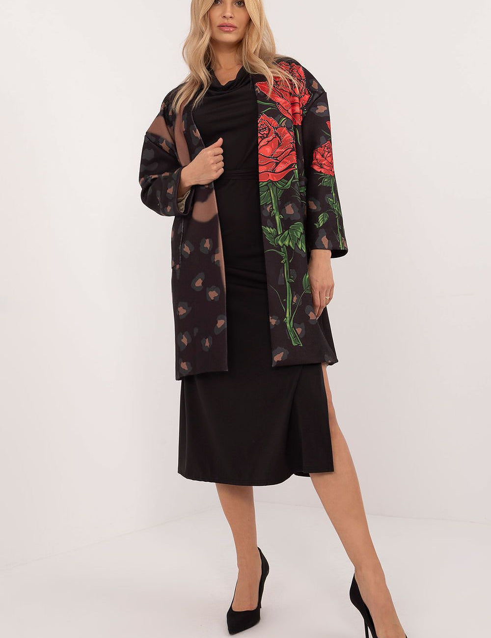 Alt Tag: Woman wearing Florénne Rhinestone Rose Coat with stemmed rose print and rhinestone accents, styled for elegance and comfort.