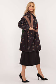 Woman wearing Florénne Rhinestone Rose Coat with stemmed rose print and rhinestone accents, ideal for stylish transitional layering.