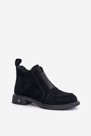 Lunavea black suede ankle boots with side zip, flat heel, and rounded toe for everyday wear, featuring decorative tongue and elastic insert.