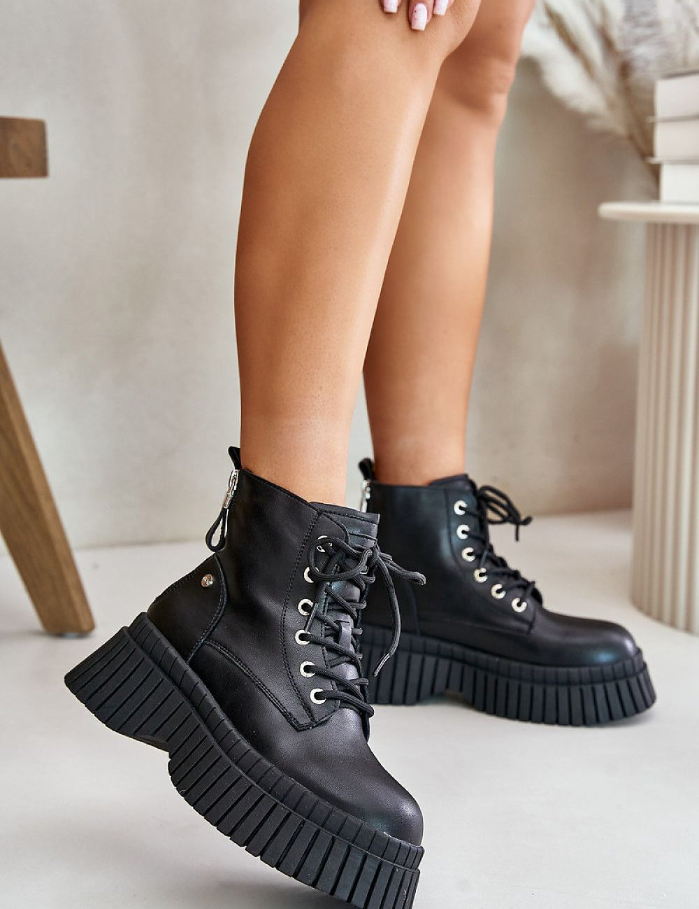 Tavareen Griptrail Insulated Trapper Boots with thick platform sole and black leather exterior, perfect for rugged urban walks.