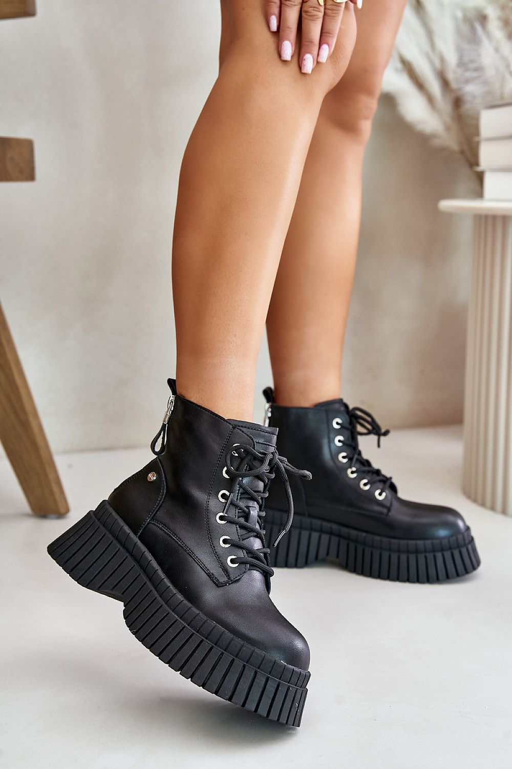 Tavareen Griptrail Insulated Trapper Boots with thick platform sole and black leather exterior, perfect for rugged urban walks.