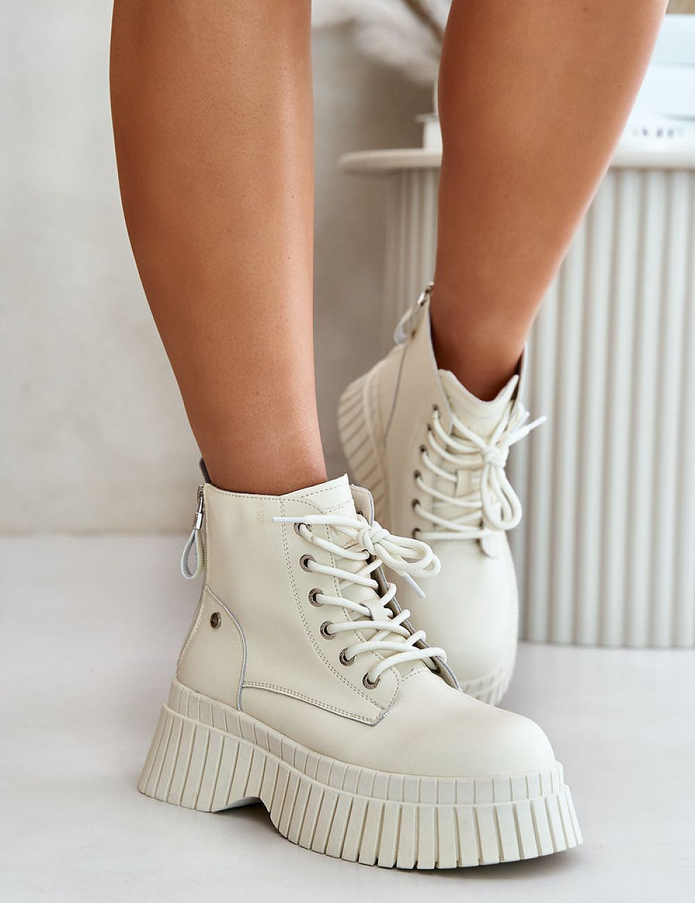 Tavareen Griptrail Insulated Trapper Boots in natural leather with thick platform sole and side zipper for secure fit.