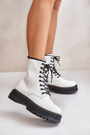 Woman wearing Liravelle Corefit insulated eco leather platform boots with laces and side zipper, elevated on solid platform sole.