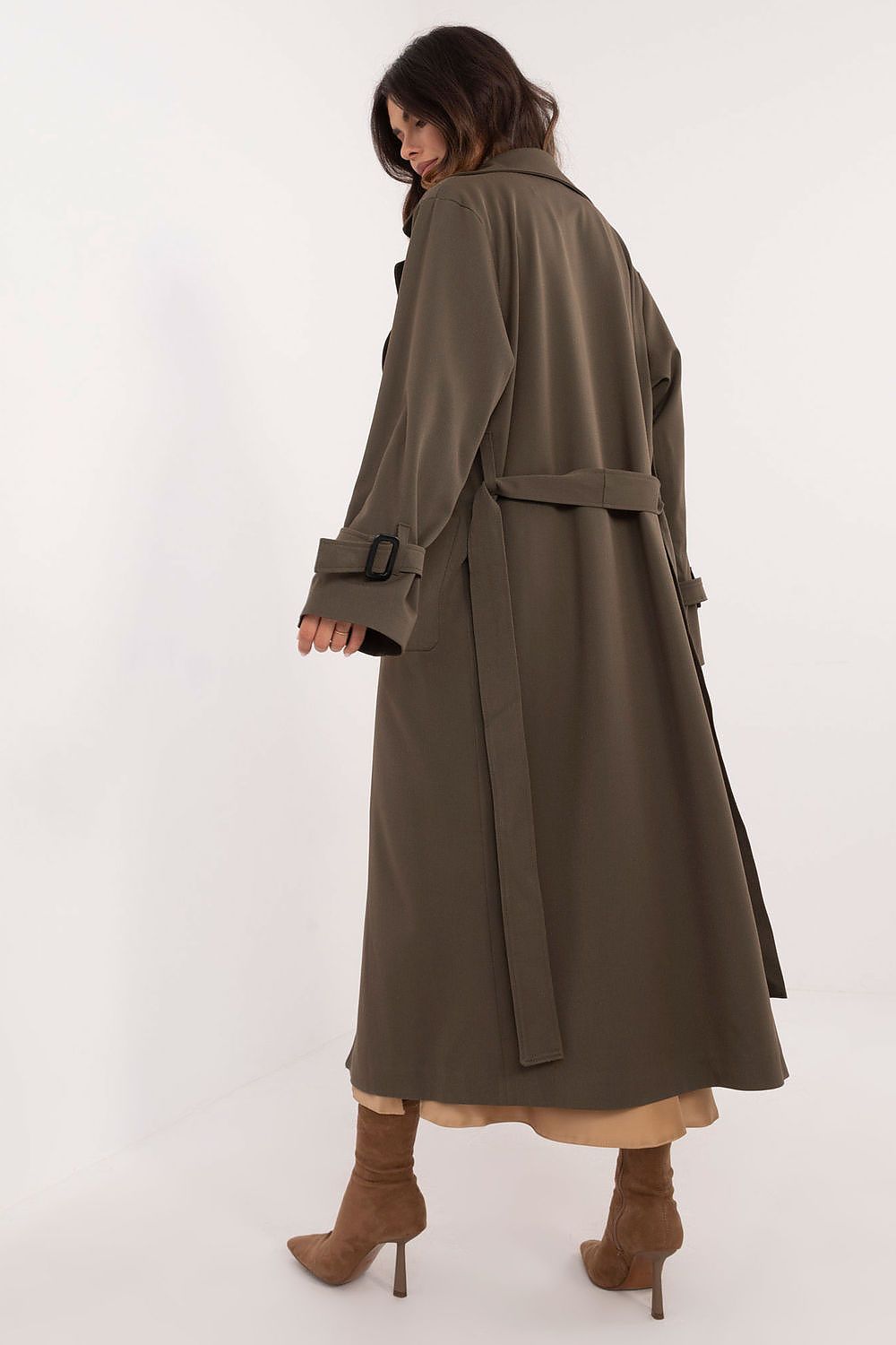 Back view of a woman wearing an Auremere Double-Breasted Trench Coat, showcasing its tailored fit and versatile design for all seasons.