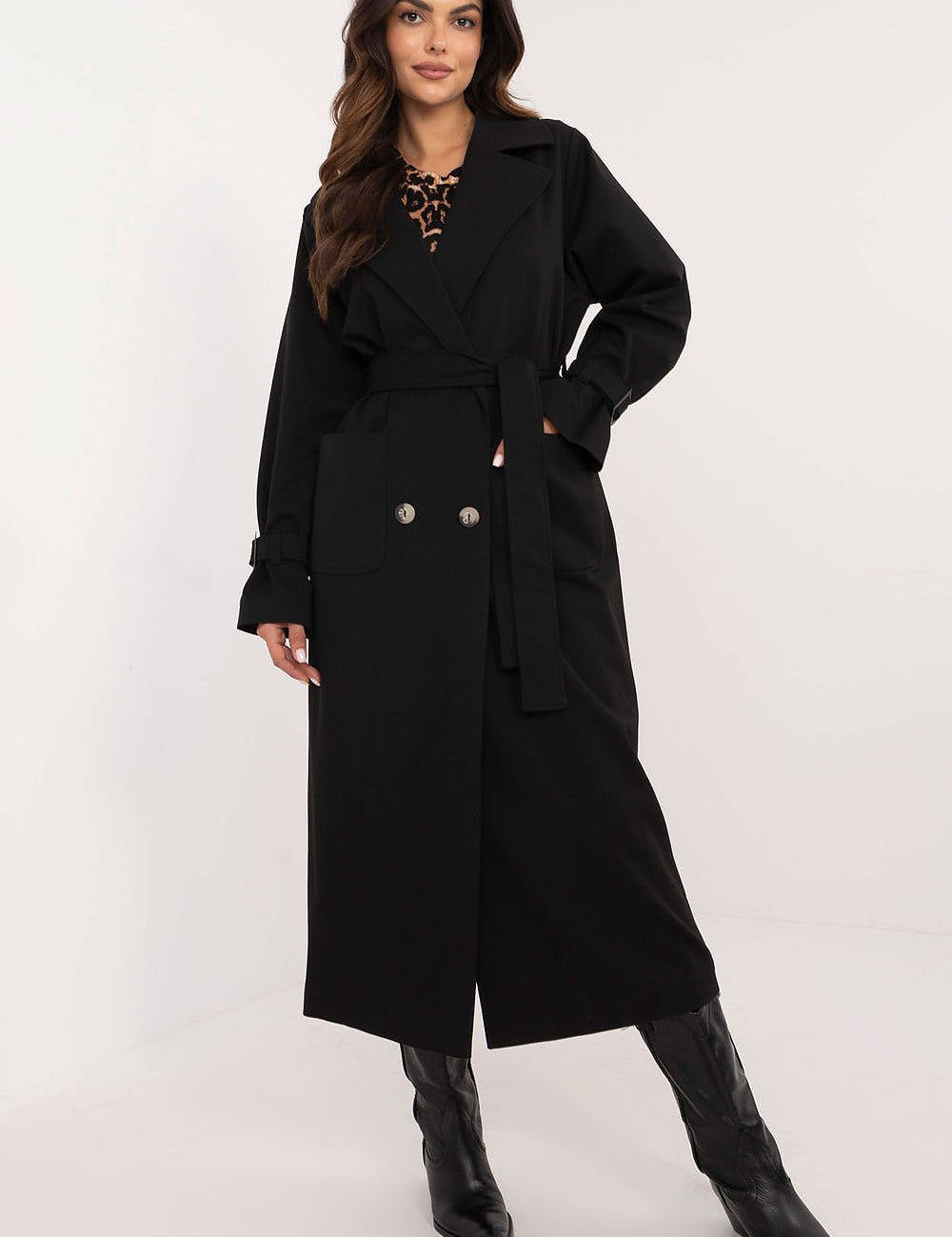 Woman wearing Auremere Double-Breasted Trench Coat in black, showcasing its elegant, tailored fit and versatile style.