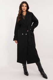 Woman wearing Auremere Double-Breasted Trench Coat in black, showcasing its elegant, tailored fit and versatile style.