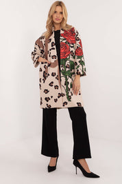 Woman wearing Florénne Rhinestone Rose Coat with rose print and rhinestone accents, showcasing lightweight elegance for transitional seasons.