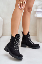 Woman wearing Virellune Frostlace Suede Rhythm boots with decorative lacing and eco-suede finish for cool-weather style.