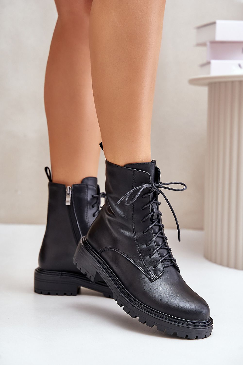 Arvenna Insulated Everyday Boots in black leather, with classic lacing, side zipper, and flat heel for urban winter comfort.