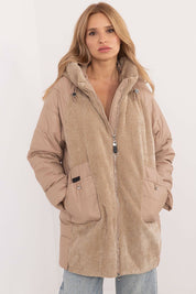 Cordivelle Quilted Hooded Jacket with corduroy front and quilted sleeves, featuring zip closure, worn by model.
