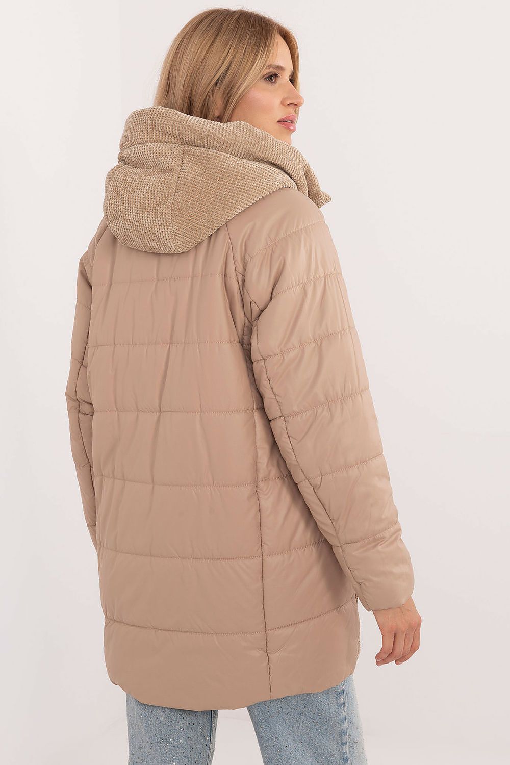 Back view of a tan Cordivelle Quilted Hooded Jacket with corduroy accents, showing quilted design and cozy hood, worn by a woman.
