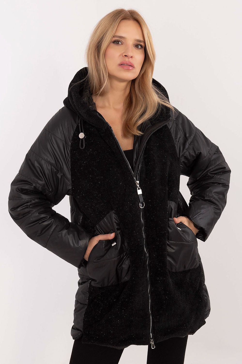 Woman wearing Cordivelle Quilted Hooded Jacket with corduroy front and quilted sections, showing zip closure and hood, in black.