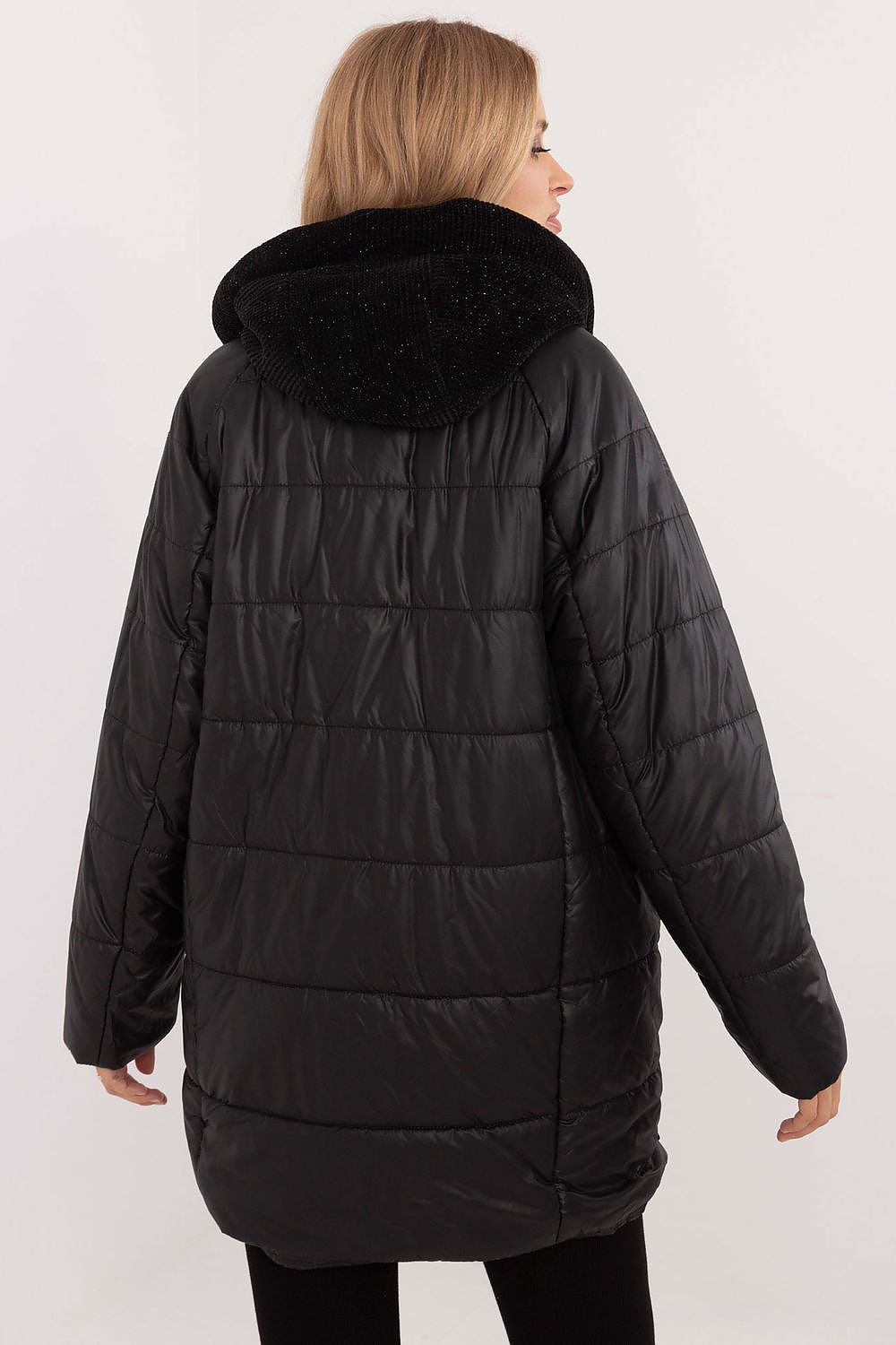 Rear view of a black quilted hooded jacket with corduroy detailing, featuring durable polyester for warmth and style in cold weather.