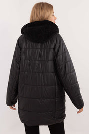 Rear view of a black quilted hooded jacket with corduroy detailing, featuring durable polyester for warmth and style in cold weather.