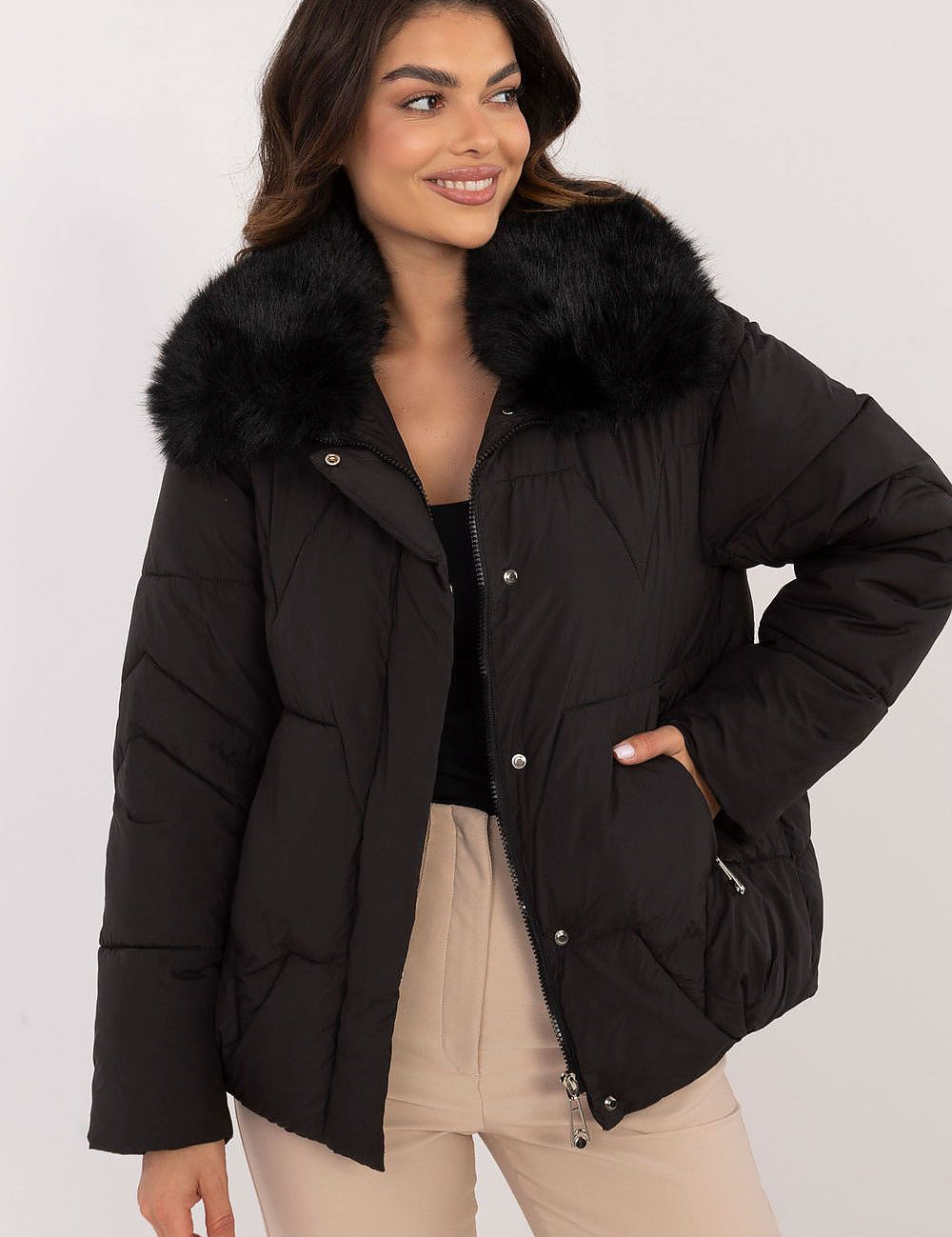 Woman wearing Merivane Quilted Fur-Collar Jacket, featuring black quilted design with fur trim, ideal for cold weather.