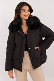 Woman wearing Merivane Quilted Fur-Collar Jacket, featuring black quilted design with fur trim, ideal for cold weather.