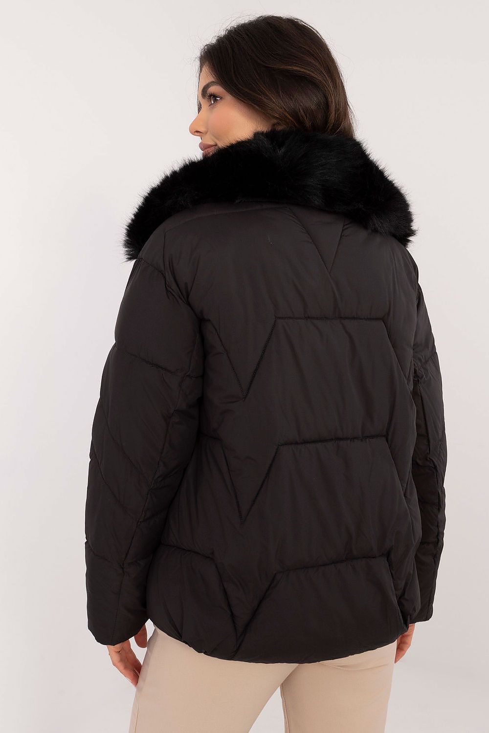 Woman wearing Merivane Quilted Fur-Collar Jacket, black with fur trim, showcasing its quilted design and elegant fur collar.