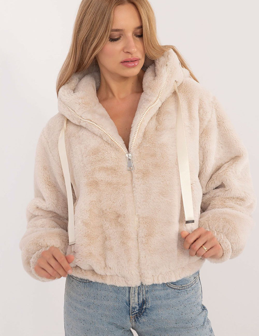 Woman wearing Althevia Hooded Viscose Jacket with zip closure and long sleeves in off-white, ideal for autumn layering.