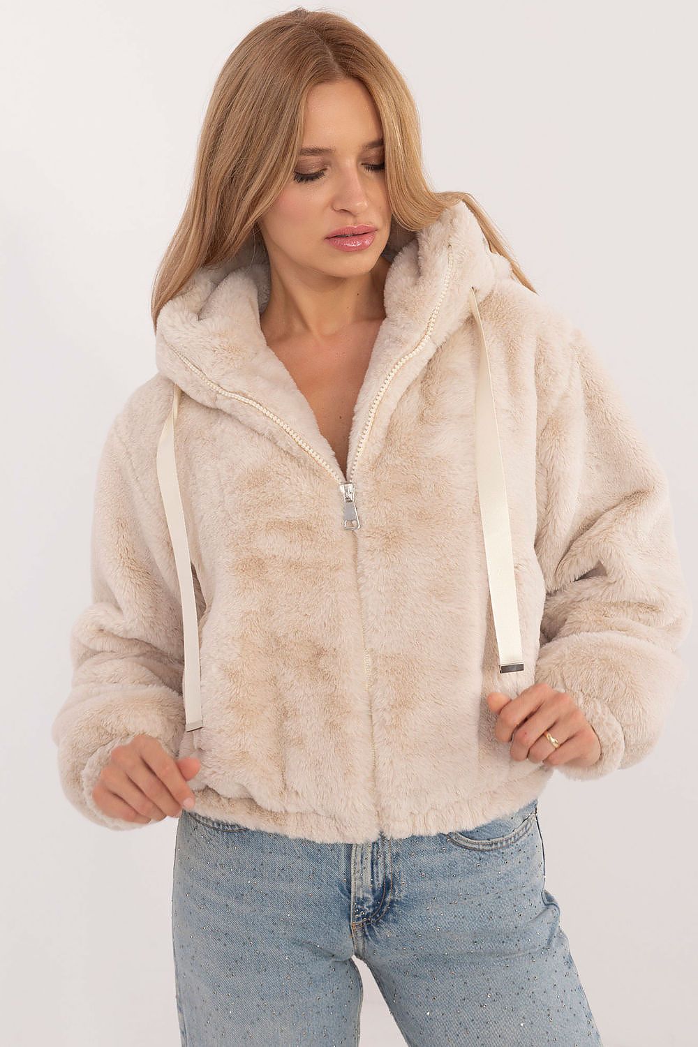 Woman wearing Althevia Hooded Viscose Jacket with zip closure and long sleeves in off-white, ideal for autumn layering.