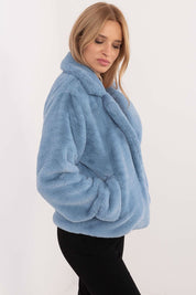 Woman wearing blue Evrosine Fur-Collar Viscose Jacket, showcasing soft fur collar and elegant design with long sleeves and discreet pockets.
