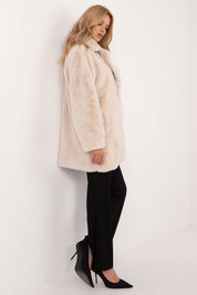 Woman wearing Cirella Viscose Mid-Season Coat, showcasing its elegant drape and beige color, perfect for autumn-winter transition.