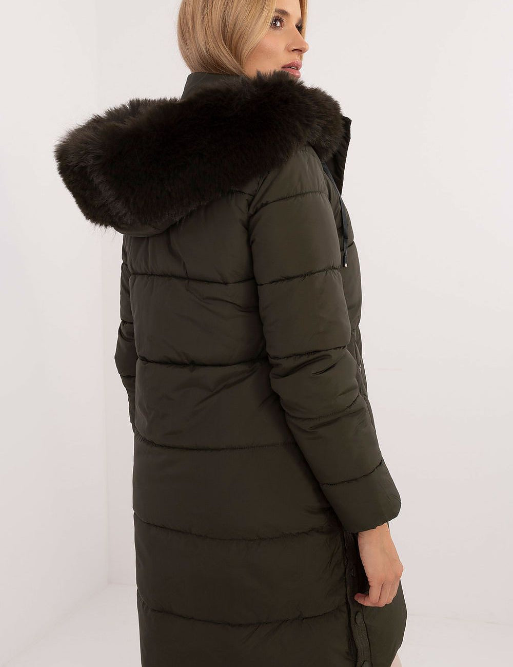 Model wearing Arden Quilted Longline Winter Jacket with detachable fur-trimmed hood, perfect for autumn and winter insulation.