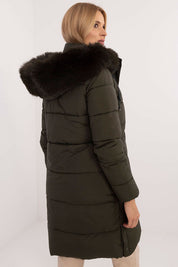 Model wearing Arden Quilted Longline Winter Jacket with detachable fur-trimmed hood, perfect for autumn and winter insulation.