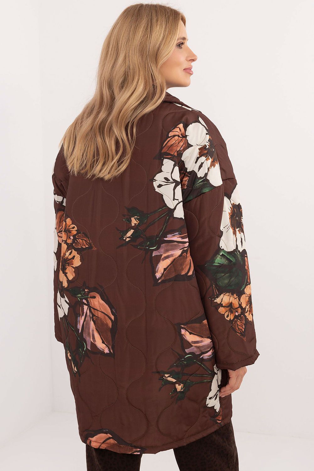 Back view of a Florencia Floral-Print Longline Jacket with subtle floral patterns, designed for transitional weather in a lightweight polyester.