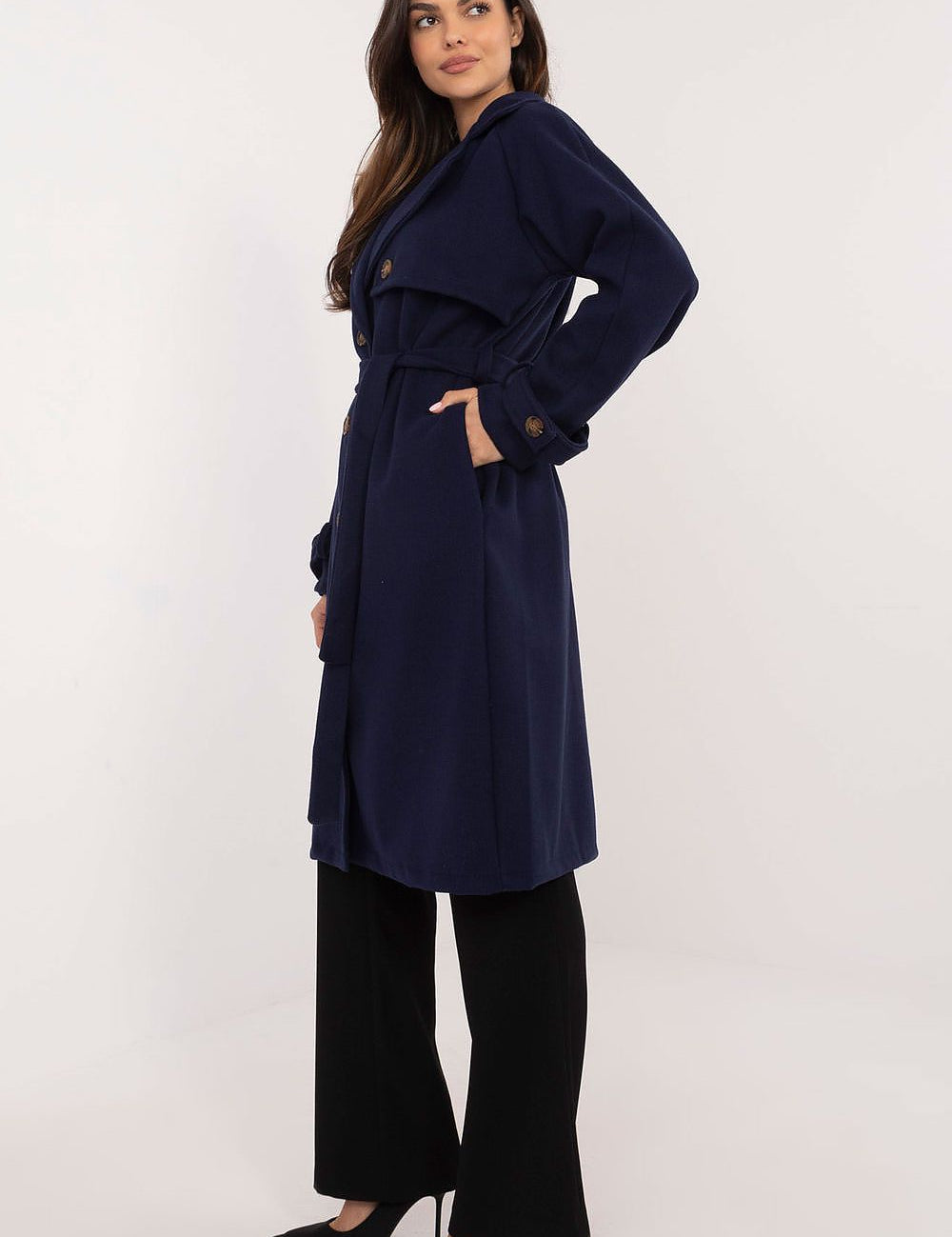 Model wearing Meriselle Belted Weather-Resistant Trench, navy, ankle-length, with waist belt and side pockets.