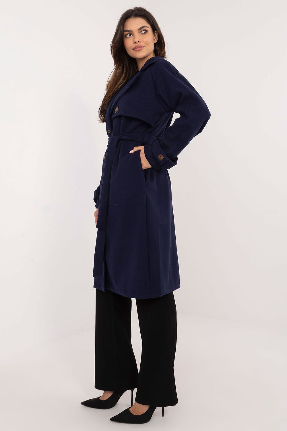 Model wearing Meriselle Belted Weather-Resistant Trench, navy, ankle-length, with waist belt and side pockets.