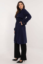 Model wearing Meriselle Belted Weather-Resistant Trench, navy, ankle-length, with waist belt and side pockets.