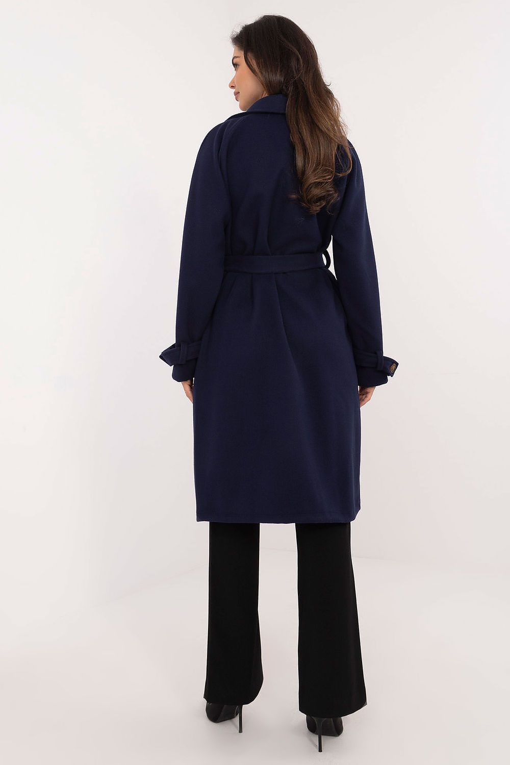 Back view of woman wearing navy Meriselle belted weather-resistant trench coat with long sleeves and knee-length design.