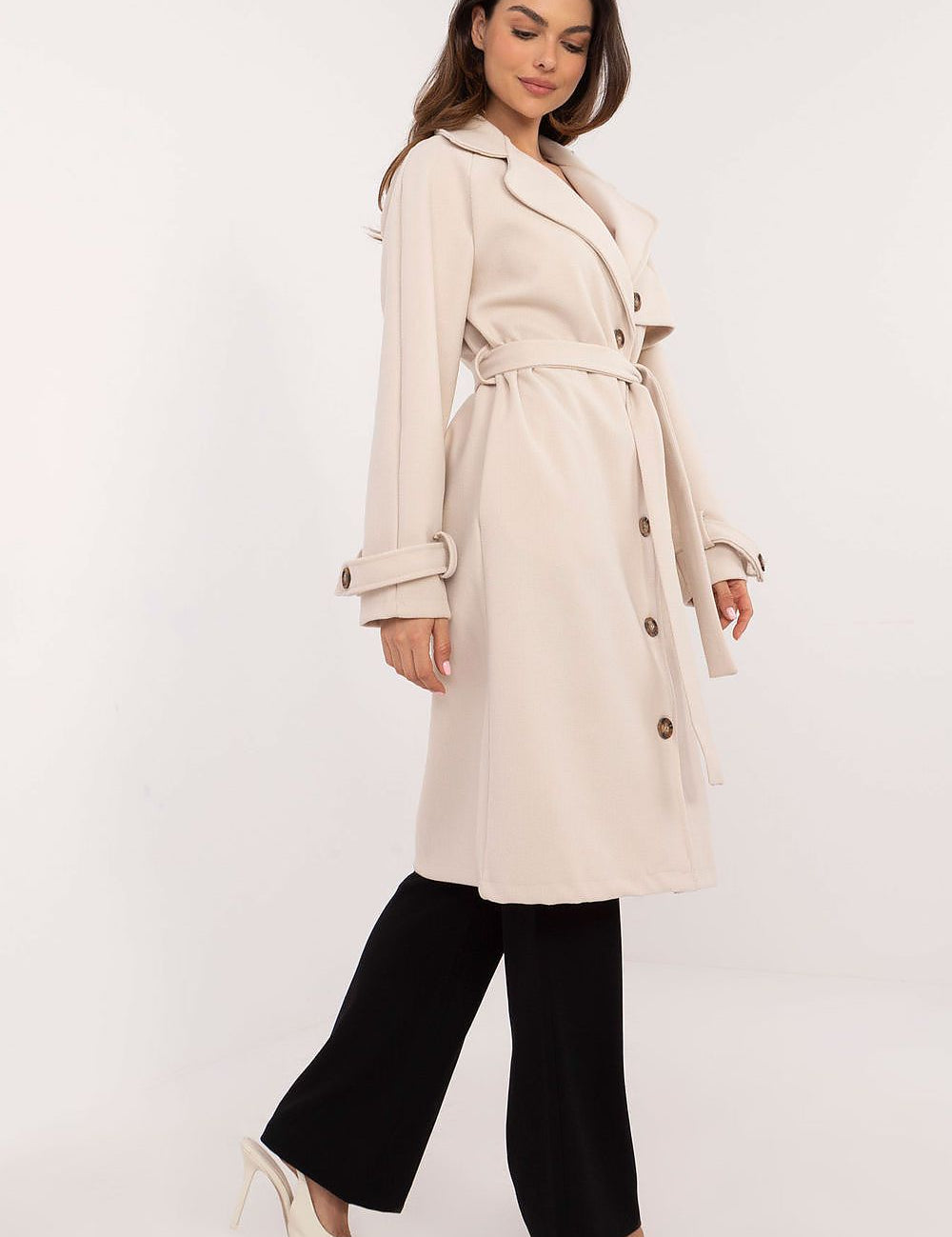 Model wearing Meriselle Belted Weather-Resistant Trench in beige, showcasing timeless design and durable polyester with button closure.