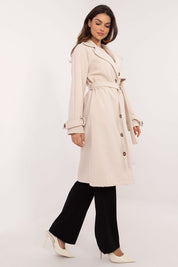 Model wearing Meriselle Belted Weather-Resistant Trench in beige, showcasing timeless design and durable polyester with button closure.