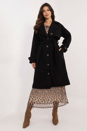 Woman wearing Meriselle Belted Weather-Resistant Trench over leopard print dress and boots, showcasing timeless style and comfort.