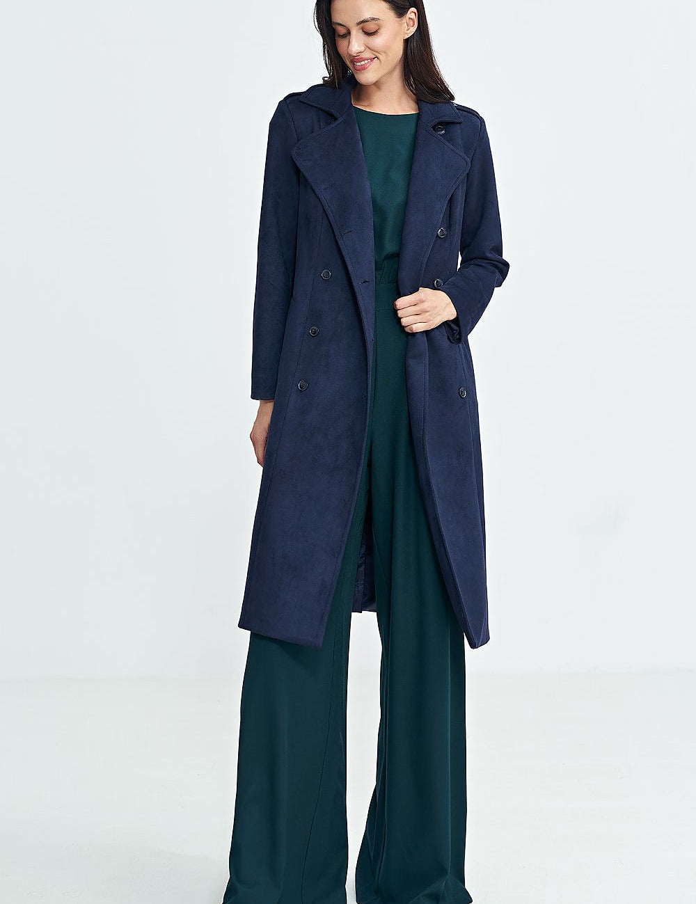 Woman wearing Aurivanne Nubuck Trench Coat with long sleeves, button closure, and shoulder epaulettes for elegant and warm style.