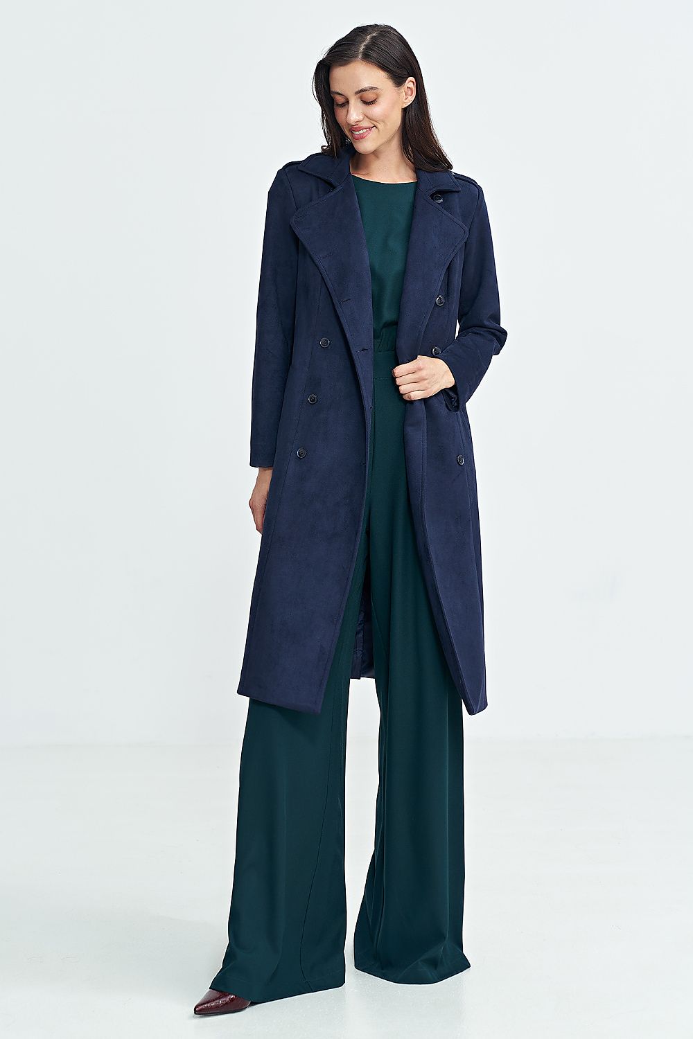 Woman wearing Aurivanne Nubuck Trench Coat with long sleeves, button closure, and shoulder epaulettes for elegant and warm style.