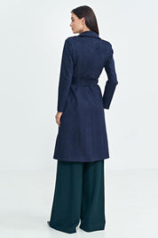 Back view of woman wearing Aurivanne Nubuck Trench Coat, highlighting long cut and elegant design.