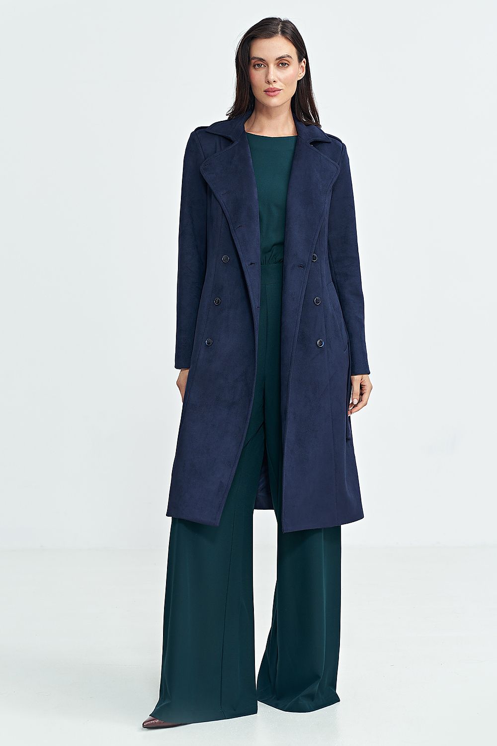 Model wearing Aurivanne Nubuck Trench Coat with long sleeves and button closure, styled with chic shoulder epaulettes for elegant warmth.