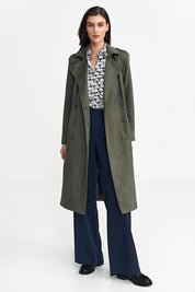 Woman wearing Aurivanne Nubuck Trench Coat with decorative shoulder epaulettes and button details, paired with wide-leg pants and printed shirt.